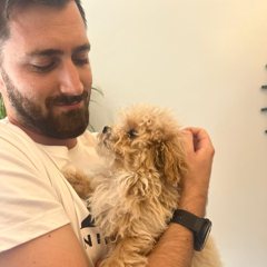 Gregory Cooke at home with his dog
