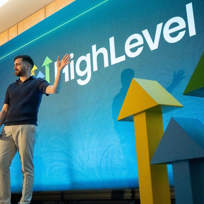 Gregory Cooke speaking on stage for HighLevel